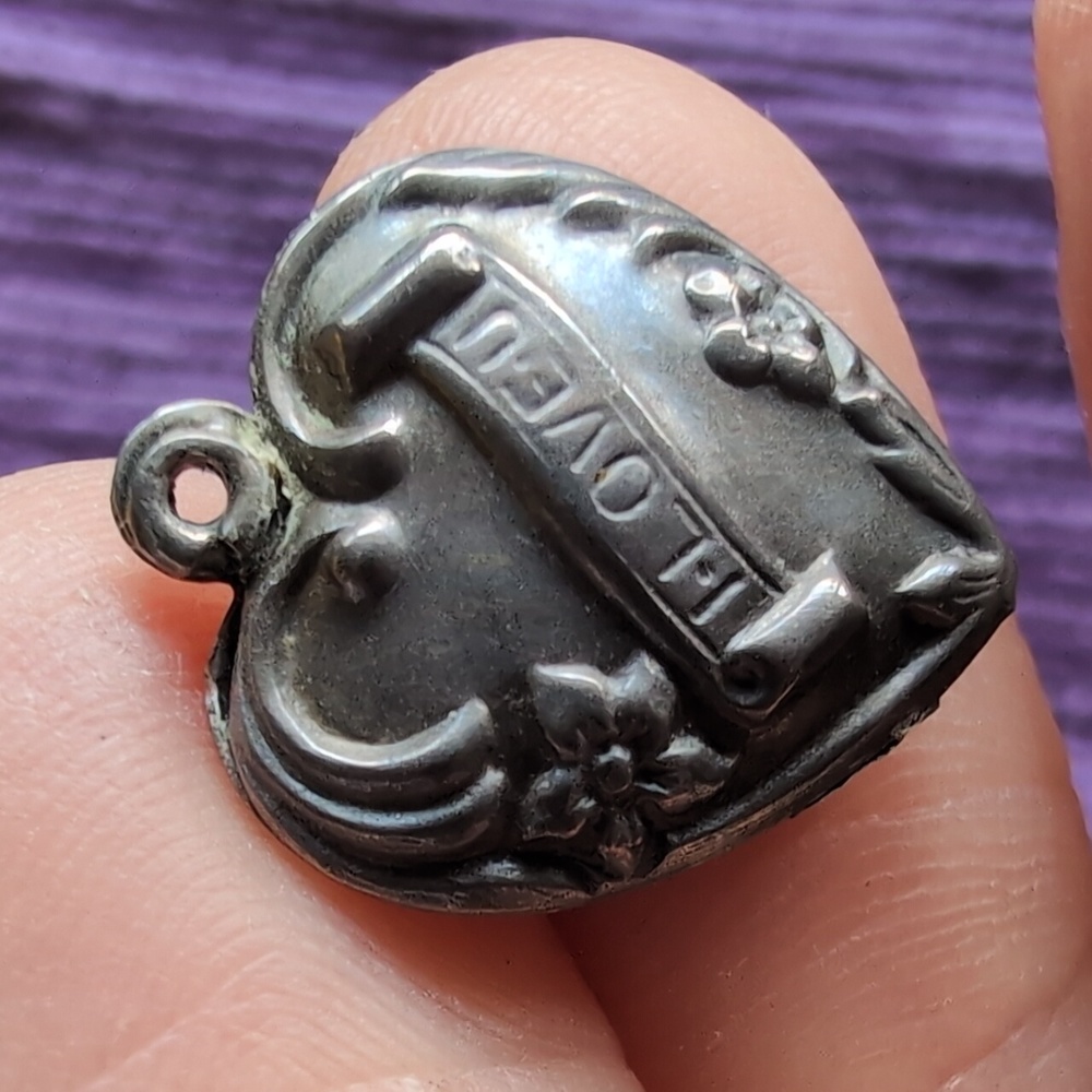 Antique sterling silver puffed heart charm